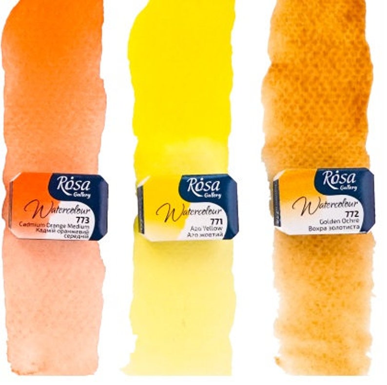 May include: Three watercolour paint tubes with labels in English and Russian. The tubes are labelled "Cadmium Orange Medium", "Azo Yellow", and "Golden Ochre".