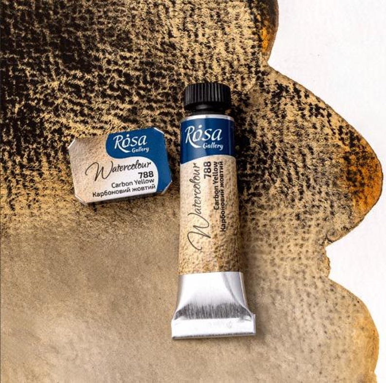 May include: A tube of R&oacute;sa Gallery Watercolor paint in the color Carbon Yellow (788). The tube is silver with a blue label and the text "R&oacute;sa Gallery Watercolor 788 Carbon Yellow Карбоновий жовтий" is printed on the label.