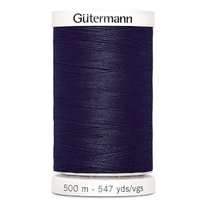 May include: A spool of dark blue Gütermann thread with a white label that reads "Gütermann" and "500 m - 547 yds/vgs".