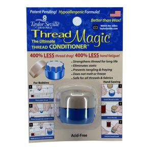 May include: A blue and silver Thread Magic thread conditioner container with the text "400% LESS thread drag! 400% LESS hand fatigue!" and instructions for use. The product is acid-free and claims to strengthen thread, eliminate static, prevent tangling and fraying, and not melt or freeze.