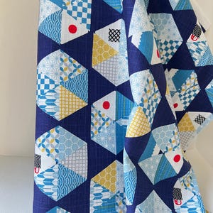 Blue, Yellow, White, Red on Navy- “Light Japanese Style”- Cosmo- 51108-2E- 44” Cotton Dobby