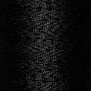 May include: A close-up view of a spool of black thread, showing the fine, tightly wound horizontal fibres that create a consistent, smooth texture across the entire surface of the spool, highlighting the deep, solid black colour of the material.