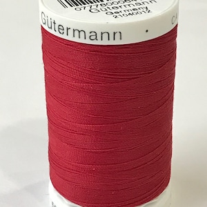 May include: A spool of red Gutermann thread with the label "Col. 420" and "07780006416 Gutermann Germany 21040012". The spool is 500 meters or 547 yards long.