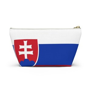 May include: A white canvas zippered pouch with the Slovakian flag printed on it. The flag features a red and white coat of arms with a double cross on a blue background.
