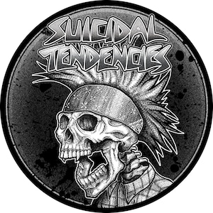 May include: A monochrome graphic featuring a skull with a mohawk and bandana, encircled by a frame. The words "SUICIDAL TENDENCIES" are displayed above. The image has a punk rock style.