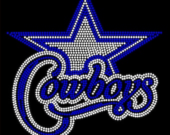 May include: A rhinestone transfer design featuring a large five-pointed star outlined in blue and white. Below the star, the word Cowboys is written in a cursive script, also formed by blue and white rhinestones against a solid black background.