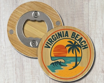 May include: A round wooden bottle opener featuring a graphic of a sunset, a palm tree, and ocean waves with the text VIRGINIA BEACH printed in a circular arc. The metal opener mechanism is integrated into the center of the circular wood piece.