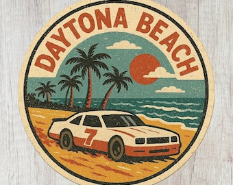 May include: A circular sticker featuring a vintage-style illustration of a white and orange race car with the number 7 on the side, parked on a sandy beach. The background shows palm trees, the ocean, and a large orange sun with the text DAYTONA BEACH.