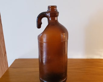 Brown bleach jug with handle Purex bleach bottle