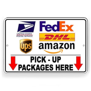 May include: White sign with black border and red arrows pointing down. The sign says "Pick-Up Packages Here" and has logos for FedEx, DHL, UPS, Amazon, and the United States Postal Service.