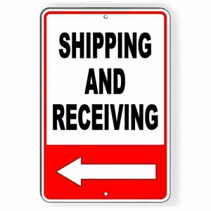 May include: White sign with a red border and a white arrow pointing to the left. The sign says "Shipping and Receiving" in black letters.