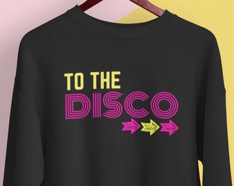 May include: Black sweatshirt with the text "TO THE DISCO" in pink and yellow with three yellow arrows pointing to the right.