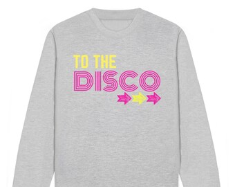 May include: A gray sweatshirt with the text "TO THE DISCO" in pink and yellow letters. Three yellow arrows point to the right.