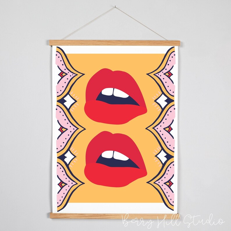 May include: A digital art print featuring two pairs of red lips on a yellow background with a pink and blue patterned border.