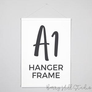 May include: A1 Hanger Frame, a white canvas with black text and a black handwritten A1 on a white background.