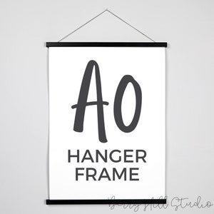 May include: A black hanger frame with the letters "AO" in a large, stylized font and the words "HANGER FRAME" in a smaller font below.