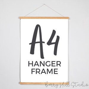 May include: A4 Hanger Frame, a wooden frame with a white background and black text. The text reads "A4 Hanger Frame".