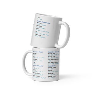 May include: Two white ceramic mugs stacked on top of each other. The top mug has a list of common electronic components in blue text. The bottom mug features Ohm's Law and resistor color codes. A great gift for engineers.