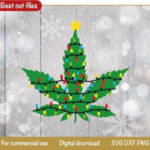 May include: A green marijuana leaf shaped like a Christmas tree with a yellow star on top and colorful lights wrapped around it. The background is a woodgrain pattern with white snowflakes.