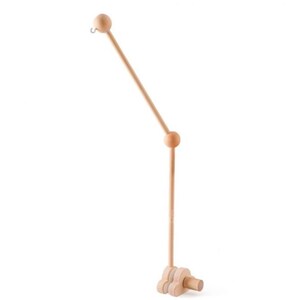 May include: A natural wood baby mobile arm with a curved design. The arm features a hook at the top for hanging mobiles, a ball joint, and a base with a decorative wooden shape. The wood has a light, unfinished appearance.