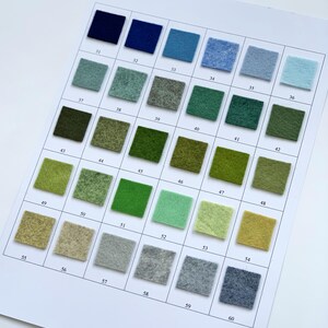 May include: A color chart featuring 30 square felt swatches in various shades of blue, green, and neutral tones. Each swatch is numbered from 31 to 60. The chart is printed on white paper, providing a visual guide for color selection.