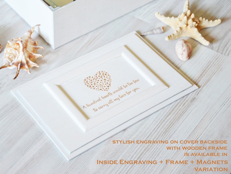 May include: White wooden box with a heart made of small gold hearts and the inscription "A hundred hearts would be too few to carry all my love for you."  The box has a wooden frame and is available with magnets.