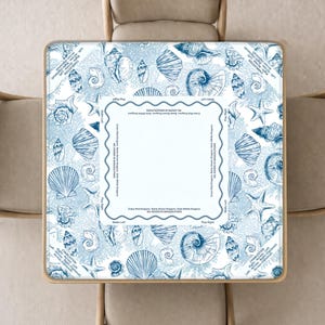 May include: A square mahjong table cover featuring a blue and white pattern of various seashells and starfish. The center includes a white square border with text reading Charleston, Play Right, Walls Left, and No Jokers in Singles/Pairs.