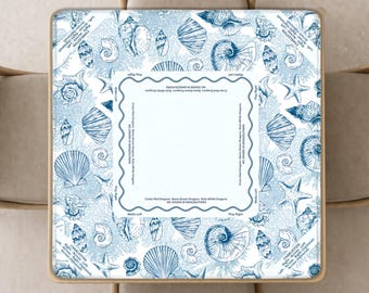 May include: A square mahjong table cover featuring a blue and white pattern of various seashells and starfish. The centre includes a white square border with text reading Charleston, Play Right, Walls Left, and No Jokers in Singles/Pairs.