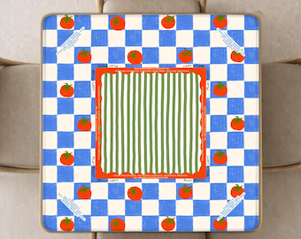 May include: A square tablecloth featuring a blue and white checkered pattern decorated with red tomato illustrations. The centre has a green and white striped square bordered by an orange frame with the text PLAY RIGHT and WALLS LEFT.