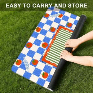 May include: A rolled-up mat with a blue and white checkered pattern and red tomato illustrations. The mat also features a green and white striped section and the text "EASY TO CARRY AND STORE".