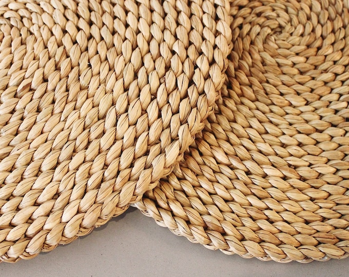 Set of woven round rush placemats