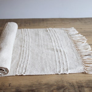 Natural cream cotton table runner with jute stripe