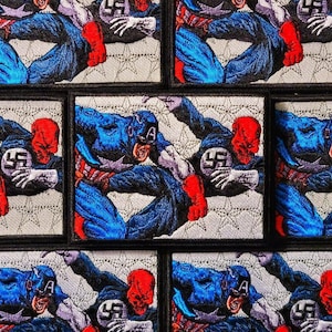 May include: Ten embroidered patches featuring a red-headed superhero figure with a swastika on their chest, fighting a blue-clad superhero figure with a red, white, and blue star on their chest. The patches are on a black background.