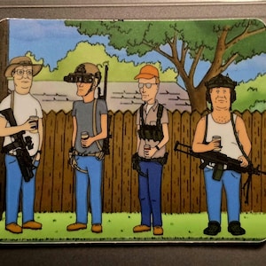 May include: A rectangular sticker featuring a cartoon image of four men in a backyard setting. Each man is holding a cup and a weapon. The men are wearing various outfits, including hats, glasses, and tactical gear. A wooden fence and green foliage are in the background.