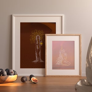 May include: Two framed illustrations of a woman with long hair, one with a desert background and the other with a pink and orange gradient background. Both illustrations are in white line art style.