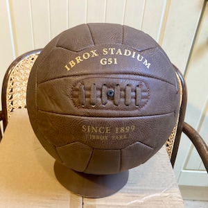 Antique leather style display football with Ibrox Stadium G51. Makes a fantastic gift for Rangers fans.