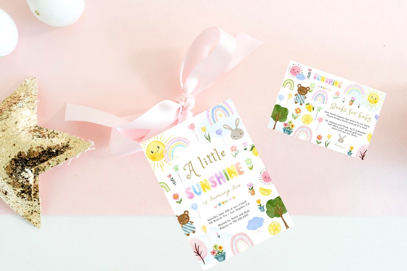 May include: A white card with a colorful rainbow, sun, and flowers design. The text on the card reads "A little sunshine is coming soon".