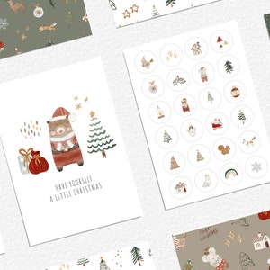 May include: A set of digital printable Christmas cards and stickers featuring a cute bear wearing a Santa hat, a Christmas tree, and the text "Have yourself a little Christmas". The designs are in a watercolor style with a green, red, and white color scheme.