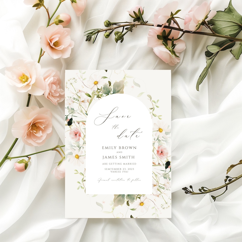 May include: Save the date card with a watercolor floral design featuring white and pink flowers. The text reads "Save the date" with the names Emily Brown and James Smith, the date September 23, 2021, and the location Varese (VA).