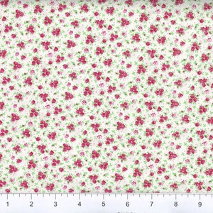 Könnte beinhalten: Weißer Stoff mit einem kleinen rosa und grünen Blumenmuster. Der Stoff ist eine Baumwollmischung und eignet sich perfekt für Quilten, Basteln und Heimwerkerprojekte.