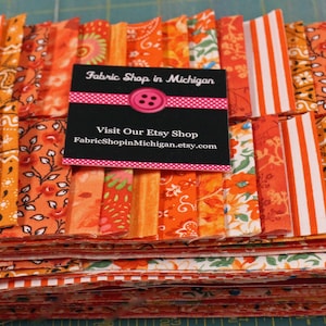 Jelly Roll Prints Oranges MDG  Jelly Roll, 40 strips Flat Folded 2 1/2 x 45 " 100 percent  Quality Cotton.