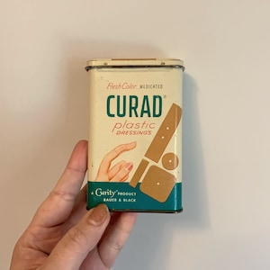 Vintage Midcentury Curad plastic dressing bandaid tin with hinged lid bobby pin holder
