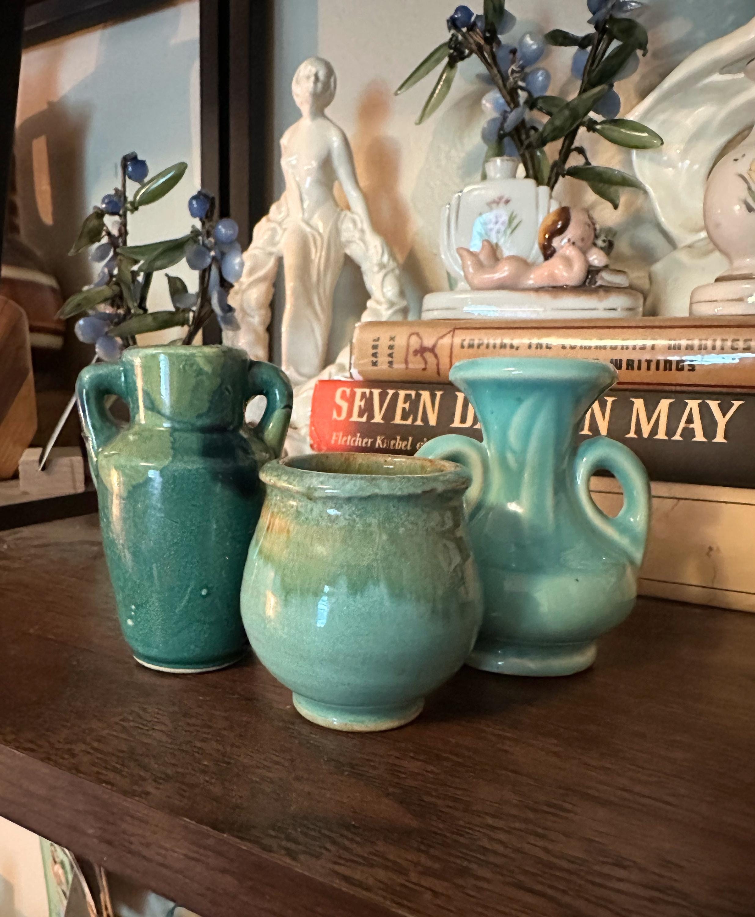 Vintage set of three green pottery bud vases