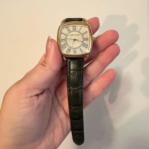 Vintage Anne Klein gold tone wristwatch with green band watch