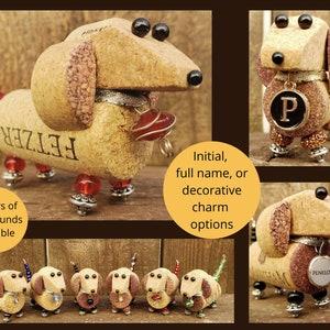 May include: Six miniature dachshund figurines made from wine corks. The dachshunds are in various colors, including brown, black, and white. Each dachshund has a personalized name tag, such as "FETZER" and "PENELOPE".