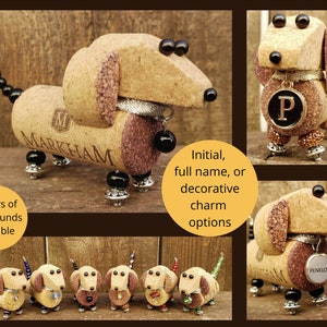 May include: Six miniature dachshund figurines made from wine corks. The dachshunds are in various colors, including brown, black, and white. Each dachshund has a small charm hanging from its neck. The charms include a bow tie, a heart, and a star. The dachshunds are standing on a wooden surface.