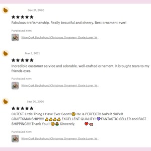 May include: Three customer reviews for a wine cork dachshund Christmas ornament. The reviews are all positive and include comments about the craftsmanship, customer service, and the overall cuteness of the ornament.