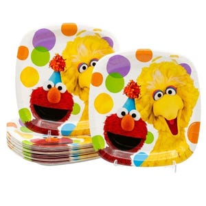 May include: A stack of square paper plates featuring a colorful design with Sesame Street characters Elmo and Big Bird. The plates are decorated with a pattern of large purple, orange, and green polka dots against a white background.