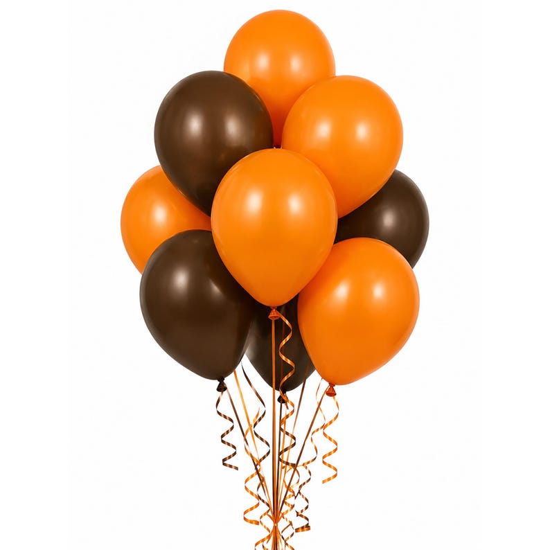 May include: A cluster of nine inflated balloons in alternating solid orange and dark brown colors. The balloons are arranged in a rounded bunch, each attached to a thin, curled ribbon in matching orange and brown shades that hang downward.