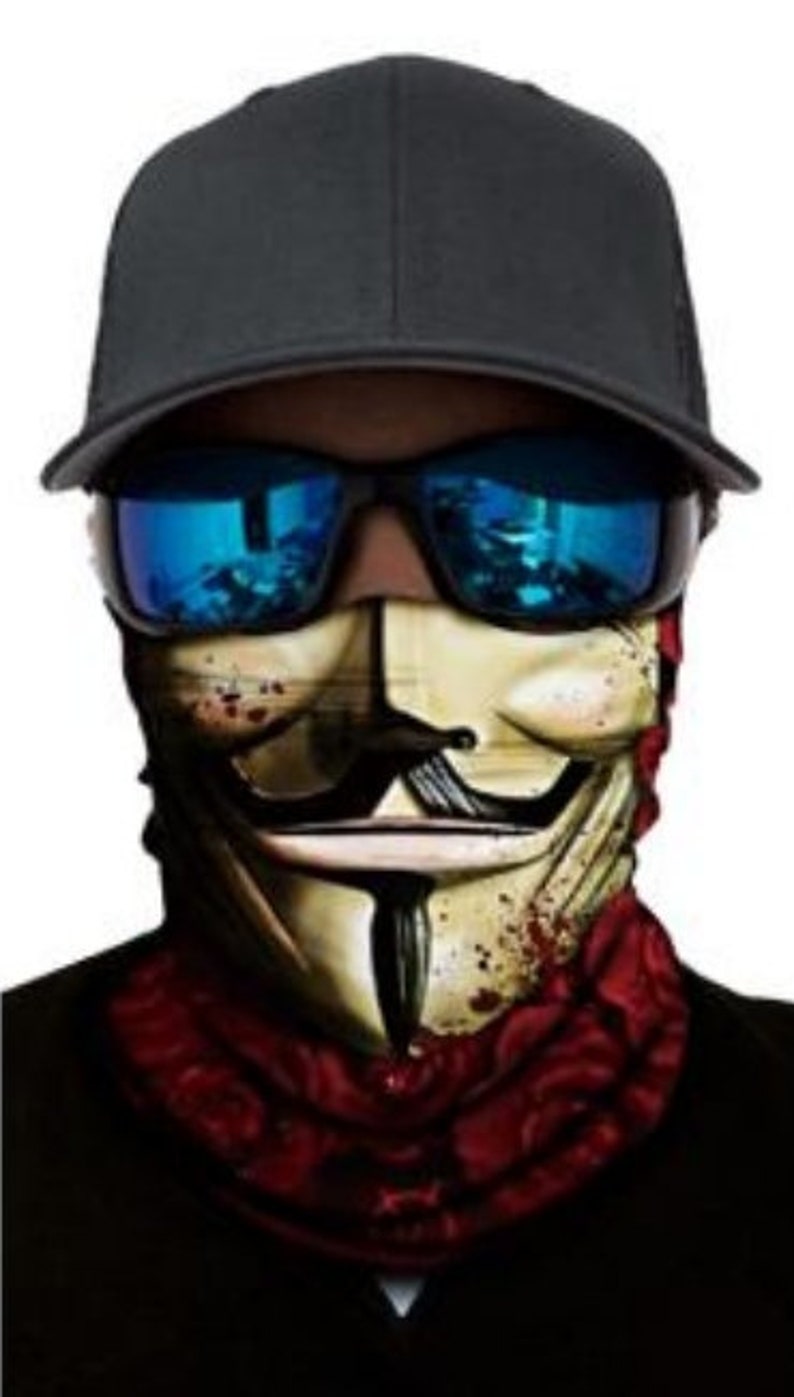May include: A black and red face mask with a graphic of the Guy Fawkes mask. The mask has a white background with black lines and a red and black bandana around the neck.